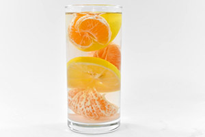 orange infused water with oranges lemon