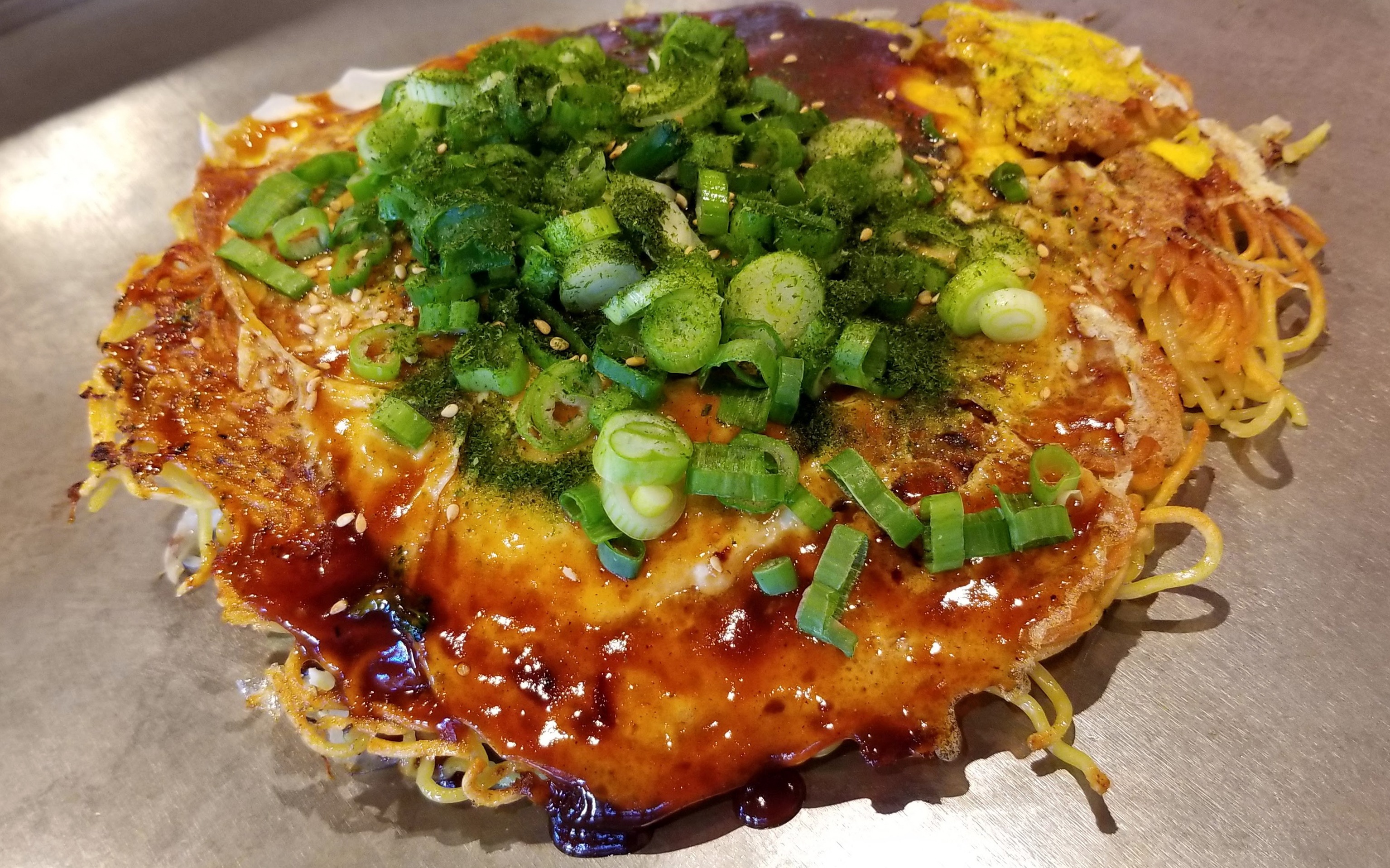 How to make the best easy okonomiyaki: savory Japanese pancakes including the best mix, recipe, ingredients, sauce, flour and some of the top restaurants near you.